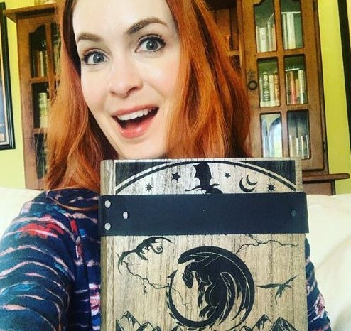 Felicia Day showing off her Nat20 DragonScape dice box from DragonBurn.com